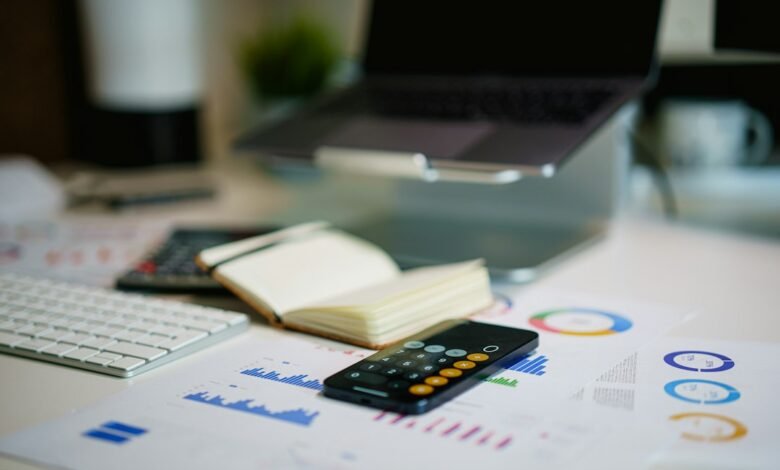 Financial report and calculator on a desk; illustrative image for a guide to loan costs and repayments