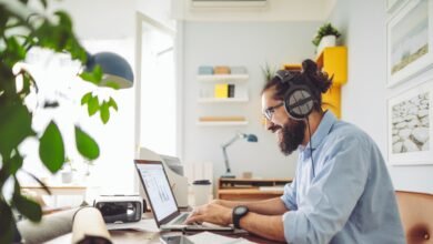 Man working on a laptop side hustle
