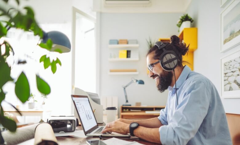 Man working on a laptop side hustle