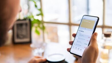 Person checking a banking app on a phone