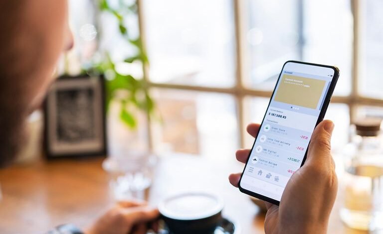 Person checking a banking app on a phone