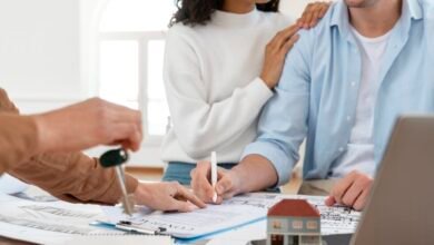 Couple signing home loan documents