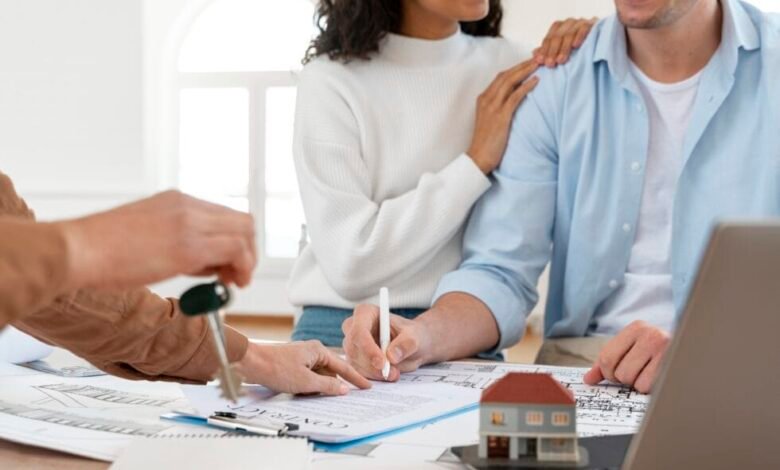 Couple signing home loan documents