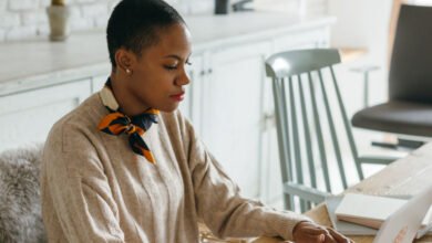 Person working on a laptop side hustle at home