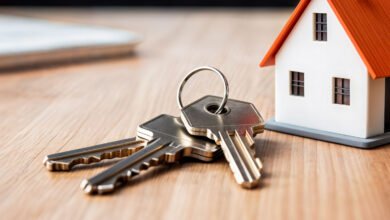 House keys beside a model home