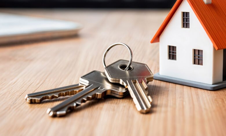 House keys beside a model home