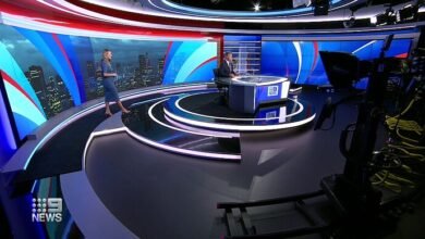 Nine News studio with the 9NEWS logo on screen