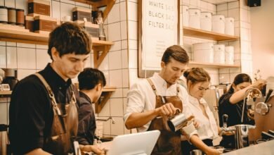 Shift workers behind the counter at a busy cafe