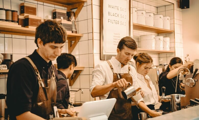 Shift workers behind the counter at a busy cafe